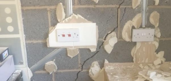 cracks beneath plasterboard
